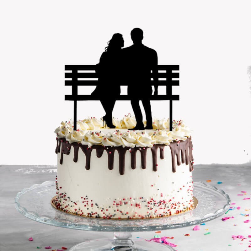 Couple Cake Topper Sitting on Bench